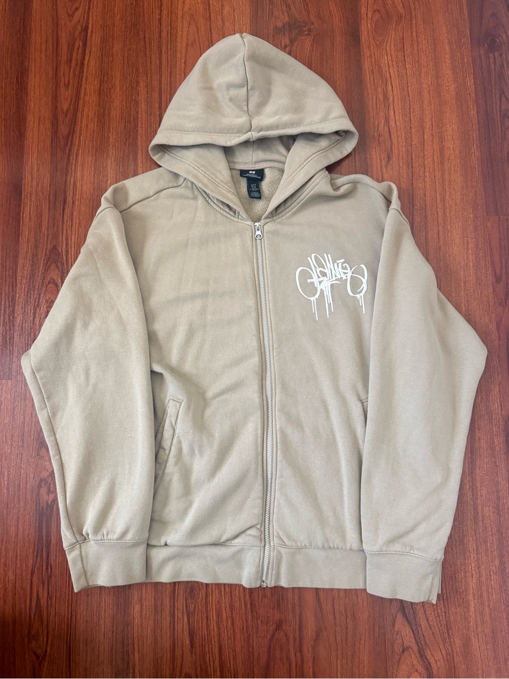 Beige Zip-Up Hoodie with White Graphic